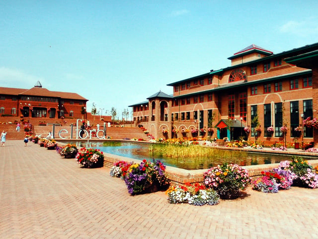 Telford Civic Square is in full bloom and colour in August 1989, with Telford County Court standing to the left and office buildings to the right.