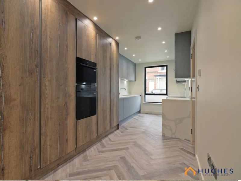 A high-spec kitchen with integrated appliances with views onto the road in one direction and a look to the cemetery on the other.