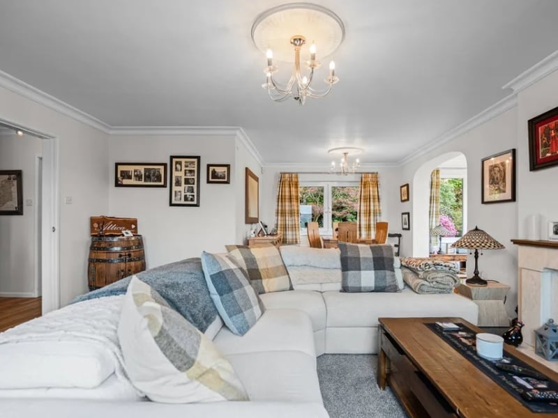 Williams & Co Estate Agents writes: "The open-plan living room and dining area is the real heart of the home - a bright, elegant room with cornice detailing, a feature fireplace and a picture window perfectly framed to capture the sweeping valley views."