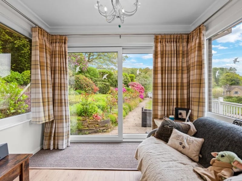 Attached to the living room is this extra sitting area with a view to the beautiful back garden.