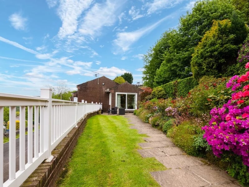 The exceptional gardens are the defining feature of this property, with years of loving care on display for the new owners to take on and enjoy. "Sweeping lawns, mature rhododendrons, vibrant seasonal planting, specimen shrubs and stone steps weave through the various levels, all framed by the valley backdrop beyond the white picket balcony."