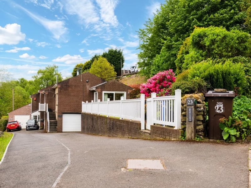 A striking feature from the outside is the white picket balcony fence enclosing the front garden.