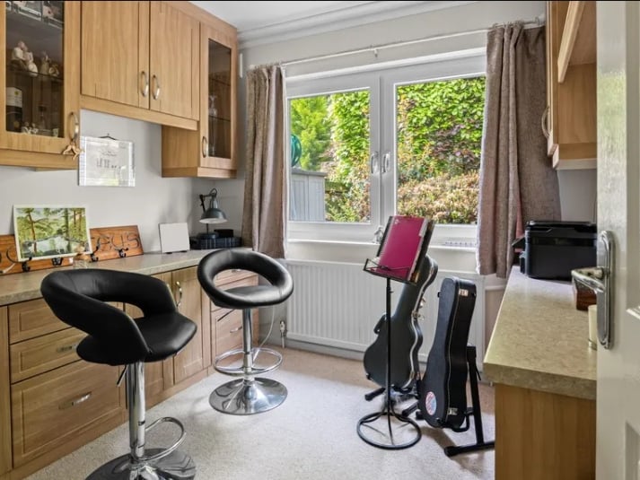 This additional bedroom has been put to use as a home office and music room. The home would perfectly suit a growing family or retired couple with room for guests.
