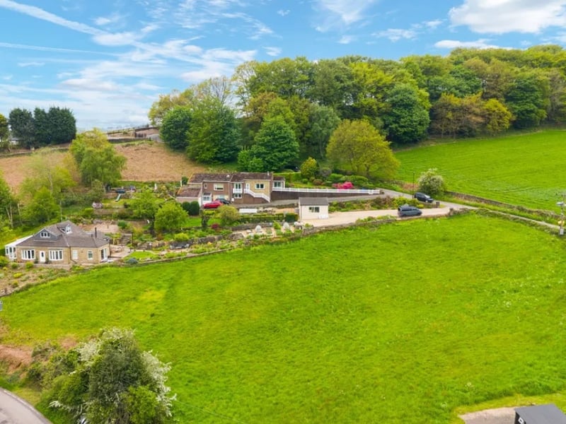 Williams & Co Estate Agents provided this aerial view of the home, showing the lush greenery surrounding the home to complement the stunning valley views.