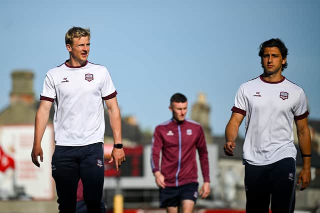 Kris Twardek and Gianfranco Facchineri walk the pitch before the game.