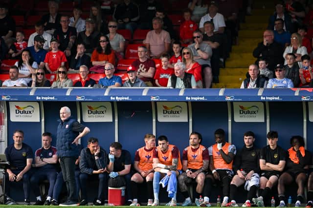 The Galway United bench look-on during the game.
