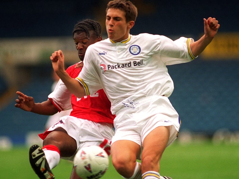 Arsenal's Gavin McGowan just takes the ball away from Leeds United's Tony Hackworth.