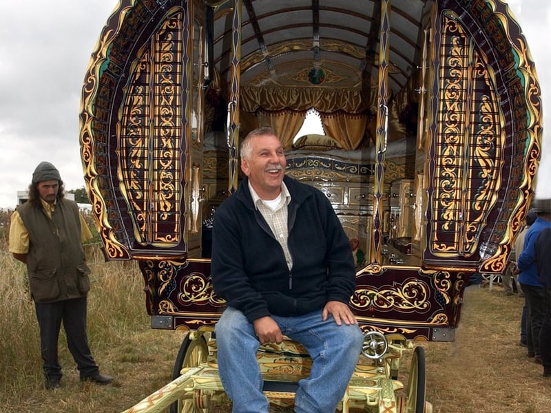 Leslie Cook from Knottingley displays a caravan he has restored in August 2003.