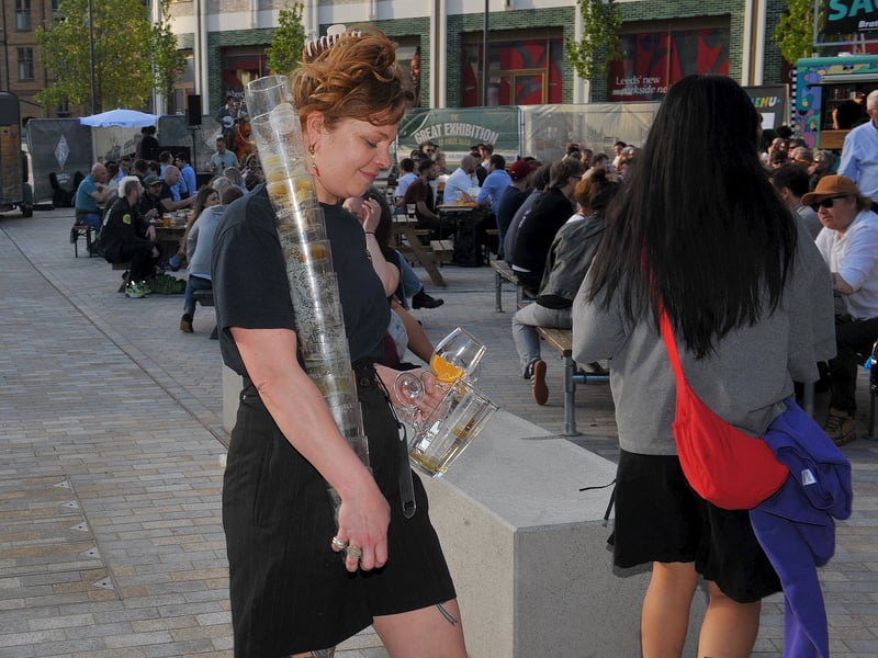 Staff collecting plenty of empty glasses at The Great Exhibition of Prize Ales.