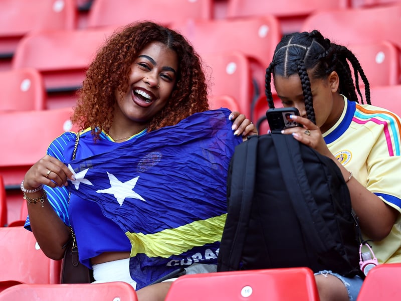Curacao fans take their seats.