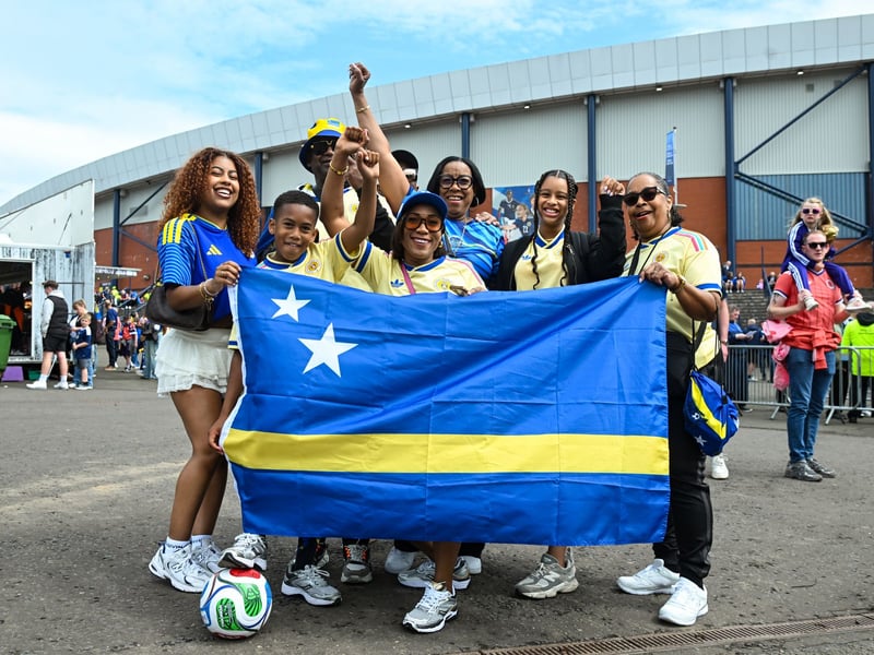 Curacao fans get into the pre-game atmosphere in Glasgow.