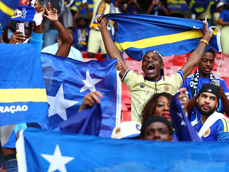 Curacao fans show their support for their team at the national stadium.
