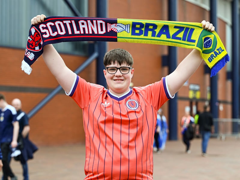 A Scotland fans with a half-and-half flag ahead of the game in Glasgow.