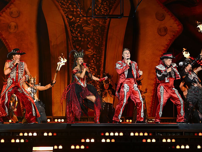 Zoe Birkett performs on stage with Mark Owen, Gary Barlow and Howard Donald of Take That during the "The Circus Live" stadium tour at St Mary's Stadium on May 29, 2026 in Southampton, England. (Photo by Gareth Cattermole/Getty Images for Take That)