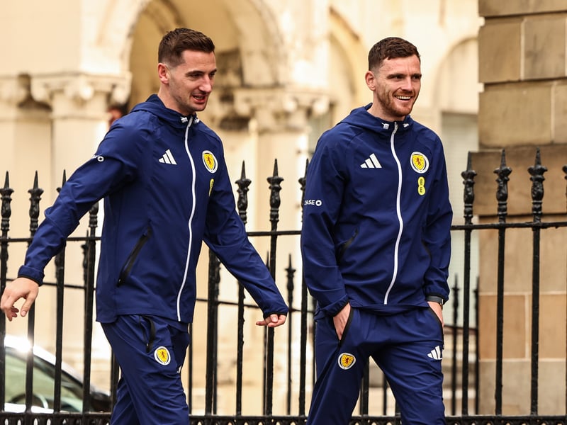 Kenny McLean and Andy Robertson prepare to board the Scotland team bus to Glasgow Airport from Blythswood Square Hotel.