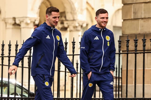 Kenny McLean and Andy Robertson prepare to board the Scotland team bus to Glasgow Airport from Blythswood Square Hotel.