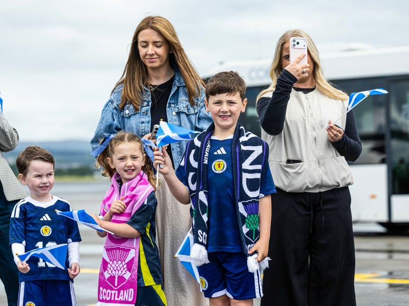 Scotland fans greet the squad as they depart for Florida from Glasgow Airport.