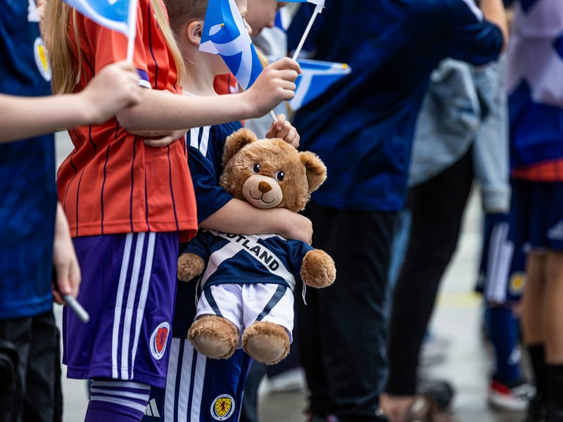 Scotland fans greet the squad as they depart for Florida from Glasgow Airport.