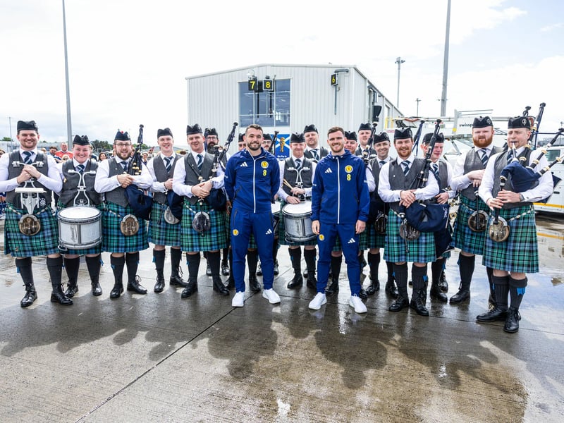 Scotland fans greet the squad as they depart for Florida from Glasgow Airport.