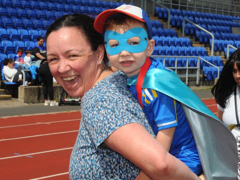 Superhero mum Emma Wright who carried her little superhero Finlay, two, round the second half of the course