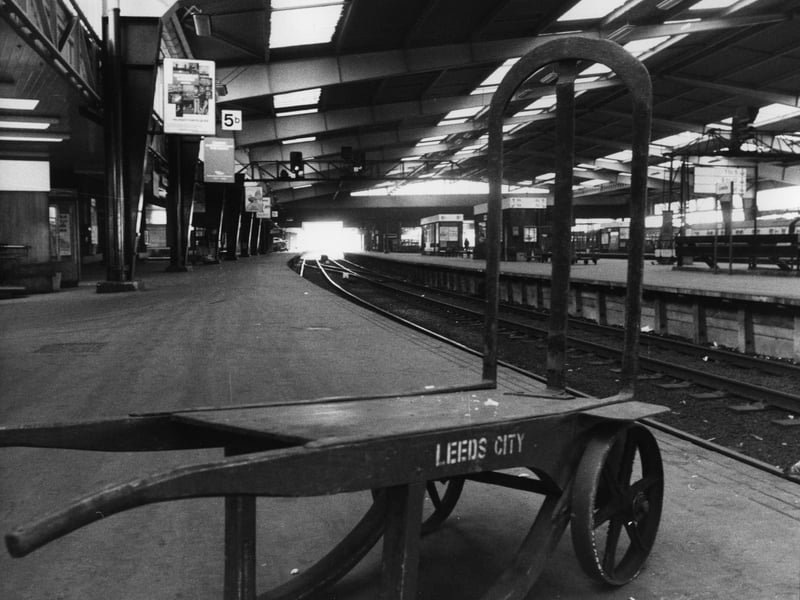 March 1976 and a porter's barrow stands empty on one of the deserted platforms at Leeds City Station, from where only a limited service of local trains are operating owing to the rail strike.