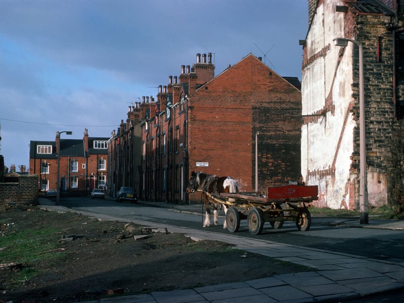 Looking along Providence Road from the junction with Pennington Street in January 1976. Quarry Mount Terrace leads off to the right. Delph Mount runs across the background. A horse and cart can be seen on the road.