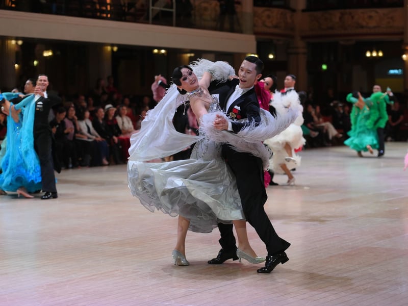 Dancers dressed in elegant ballroom attire take to the floor on the final day of the 100th Blackpool Dance Festival at the Empress Ballroom, Winter Gardens Blackpool.