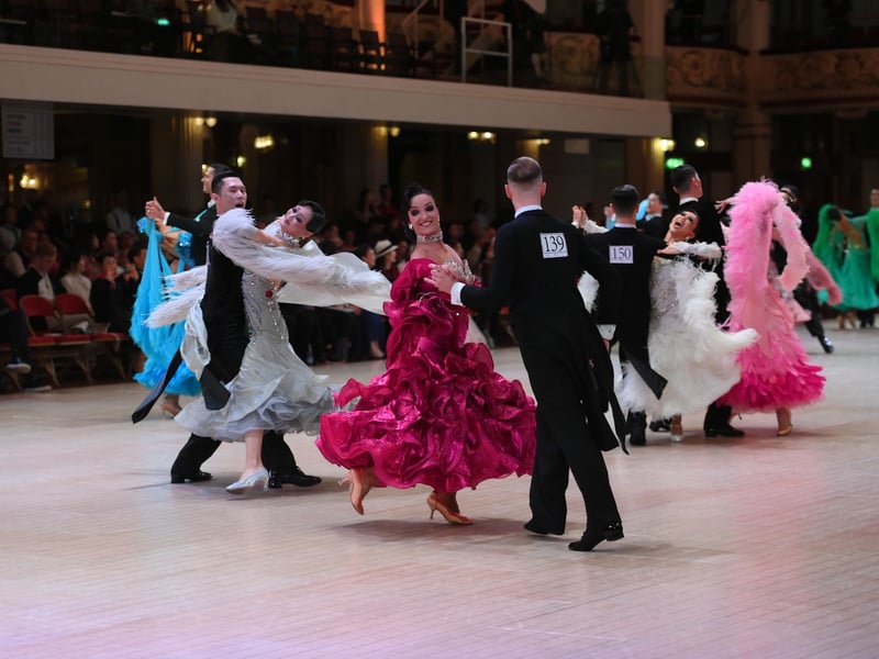 Dancers dressed in elegant ballroom attire take to the floor on the final day of the 100th Blackpool Dance Festival at the Empress Ballroom, Winter Gardens Blackpool.