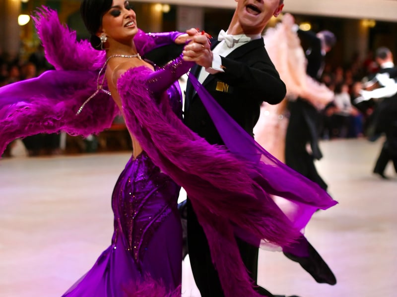 Dancers dressed in elegant ballroom attire take to the floor on the final day of the 100th Blackpool Dance Festival at the Empress Ballroom, Winter Gardens Blackpool.