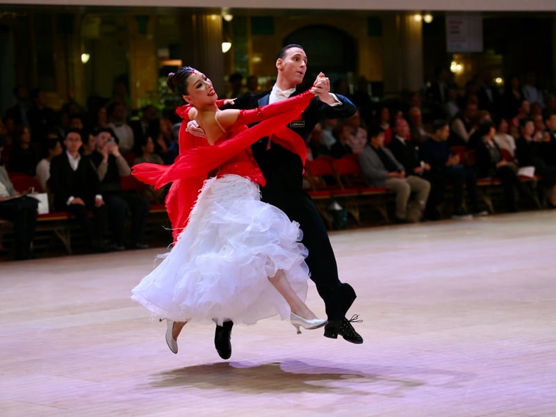 Dancers dressed in elegant ballroom attire take to the floor on the final day of the 100th Blackpool Dance Festival at the Empress Ballroom, Winter Gardens Blackpool.