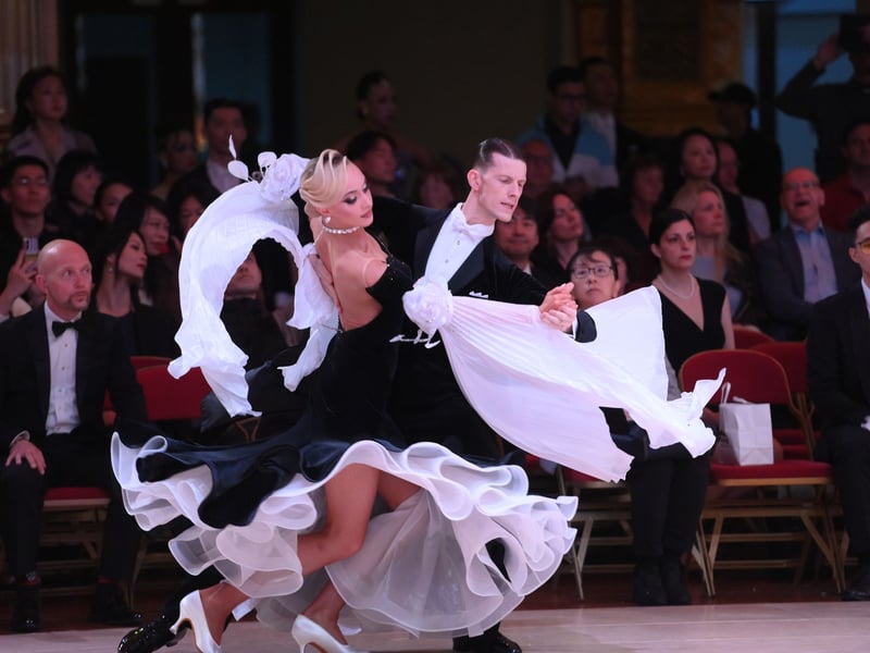 Dancers dressed in elegant ballroom attire take to the floor on the final day of the 100th Blackpool Dance Festival at the Empress Ballroom, Winter Gardens Blackpool.