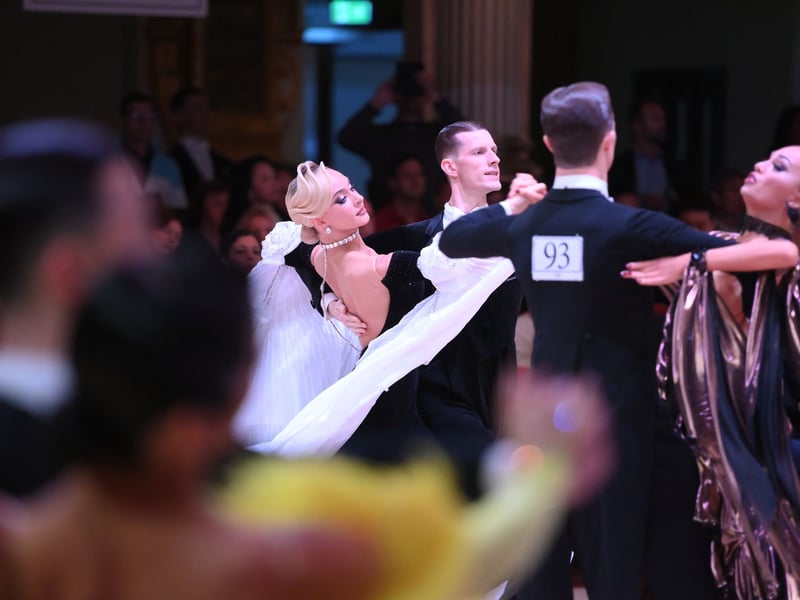 Dancers dressed in elegant ballroom attire take to the floor on the final day of the 100th Blackpool Dance Festival at the Empress Ballroom, Winter Gardens Blackpool.