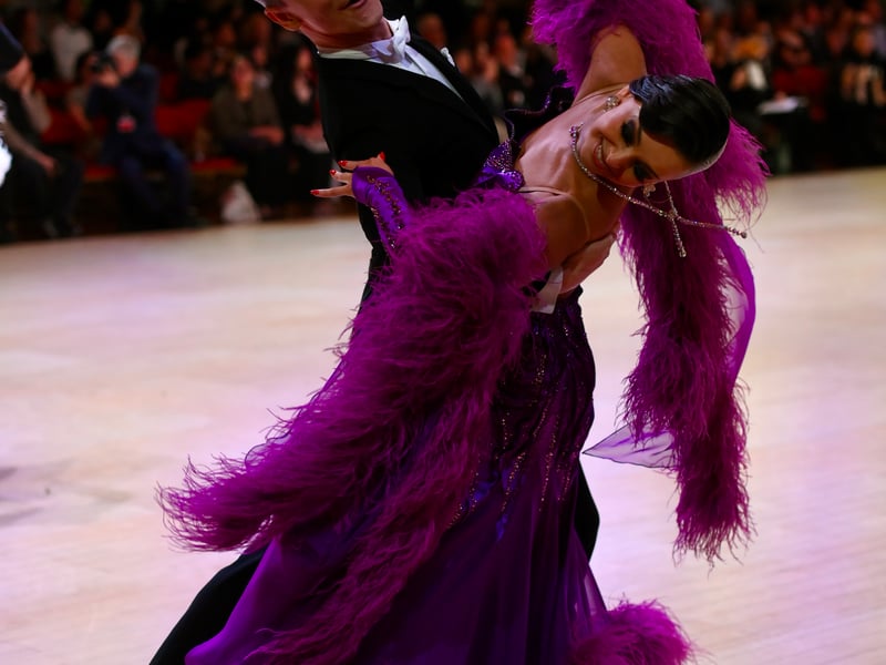 Dancers dressed in elegant ballroom attire take to the floor on the final day of the 100th Blackpool Dance Festival at the Empress Ballroom, Winter Gardens Blackpool.