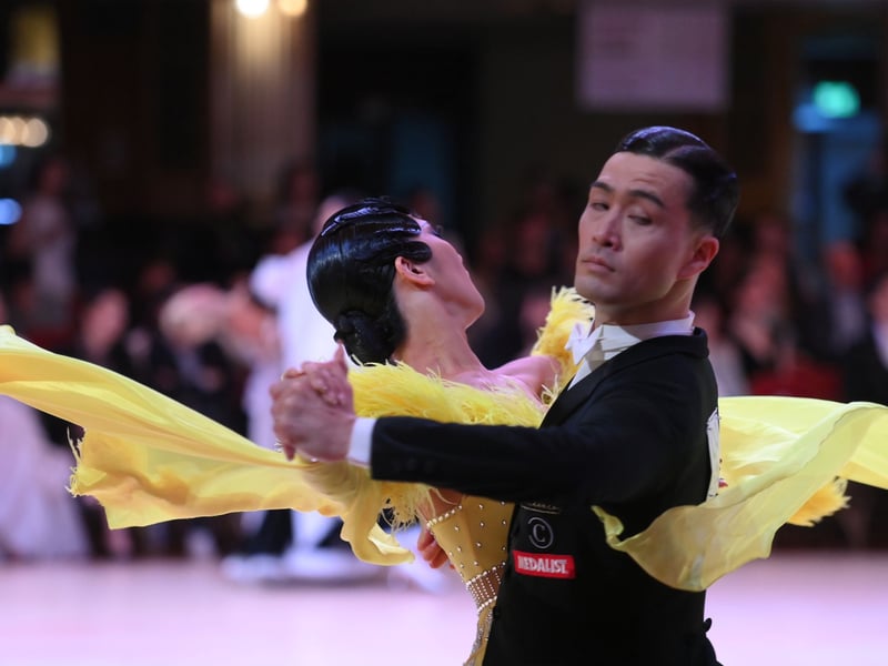 Dancers dressed in elegant ballroom attire take to the floor on the final day of the 100th Blackpool Dance Festival at the Empress Ballroom, Winter Gardens Blackpool.