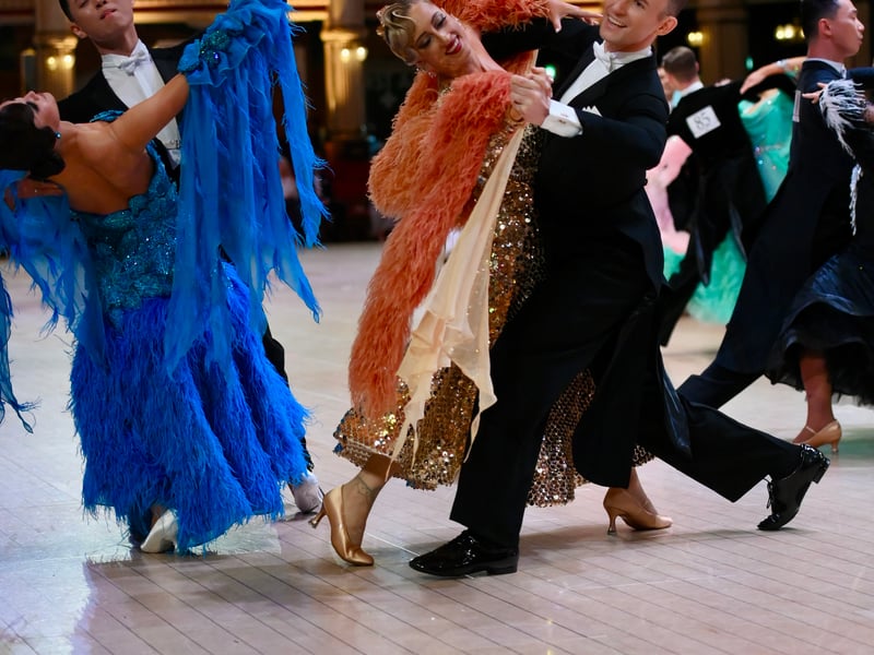 Dancers dressed in elegant ballroom attire take to the floor on the final day of the 100th Blackpool Dance Festival at the Empress Ballroom, Winter Gardens Blackpool.
