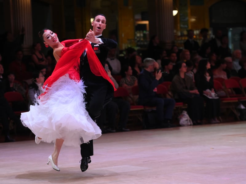 Dancers dressed in elegant ballroom attire take to the floor on the final day of the 100th Blackpool Dance Festival at the Empress Ballroom, Winter Gardens Blackpool.