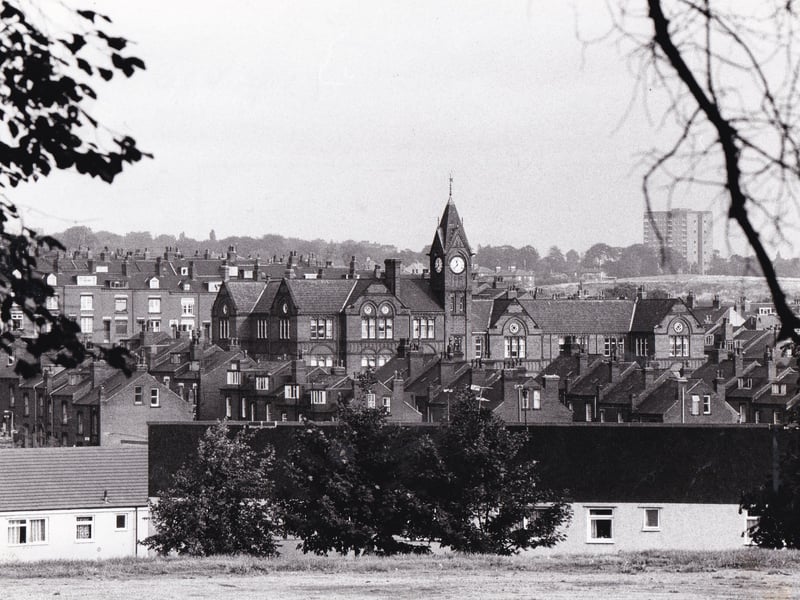 A view from Woodhouse Moor October 1985 showing part of the 12-year-old Holborn development in the foreground and the more familiar red brick terraces in the background. The imposing 100-year-old Quarry Mount Primary School with its familiar clock is in the centre and Woodhouse's only block of high rise flats Holborn Towers is in the background, right.