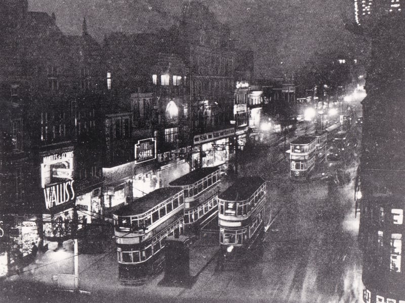 Briggate at night in 1934 when trams trundled up and down with passengers alighting for destinations such as the Empire Theatre, the Rialto Cinema and the Victory Hotel.
