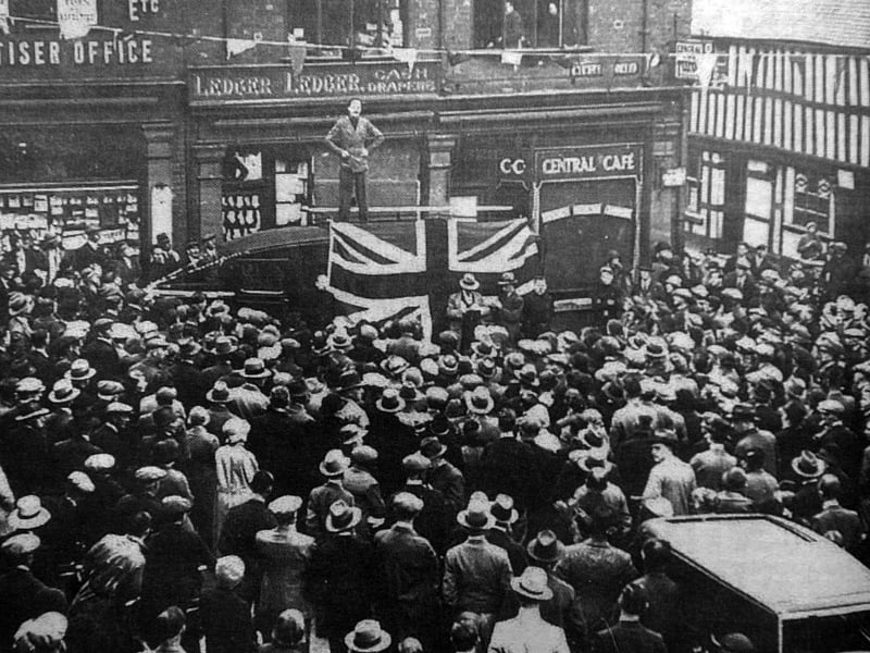 A crowd gathers in Market Drayton on May 8, 1935, as Sir Oswald Mosley addresses the public during a visit to the town.