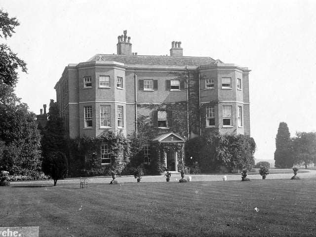 A nostalgic postcard view of Styche Hall, Market Drayton, once the home of Clive of India. This later rebuilt version of the hall stands on the historic site originally developed by Robert Clive for his parents between 1760 and 1764, replacing an earlier Elizabethan timber-framed house. The undated postcard, believed to be from around 1910, carries a note on the reverse recording this history. 