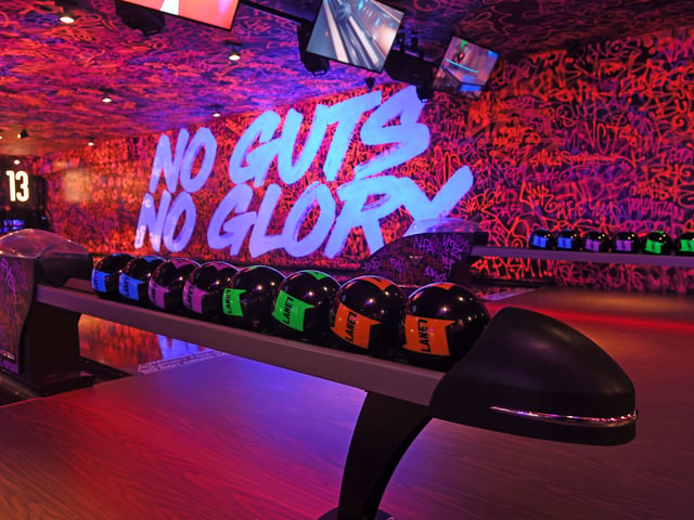 Ditching the traditional dusty alley look, the sleek lanes feature interactive technology designed to light up and celebrate every strike.