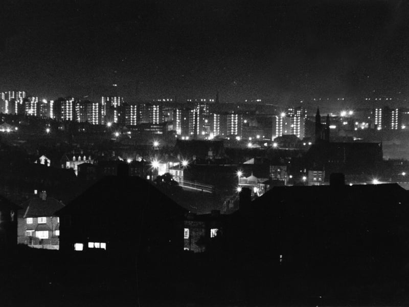 A night view of the ten-storey flats of the Lincoln Green Estate, seen from the high ground behind Scott Hall Road. Pictured in February 1963.