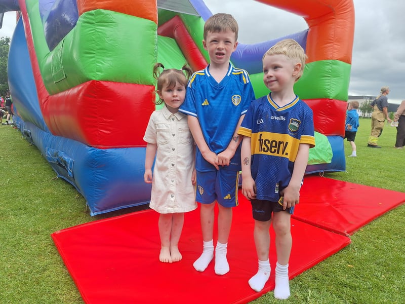 Jade Morrissey, Calvin and Noah Boland enjoying the bouncy castles at the Clancy Brothers Music & Festival 