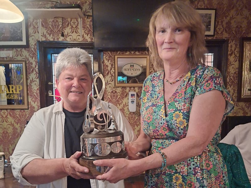 Katerine Power (right), widow of the late Eoghan Power, presents Amanda Greene (left) with the Eoghan Power Memorial Folk Singing Trophy