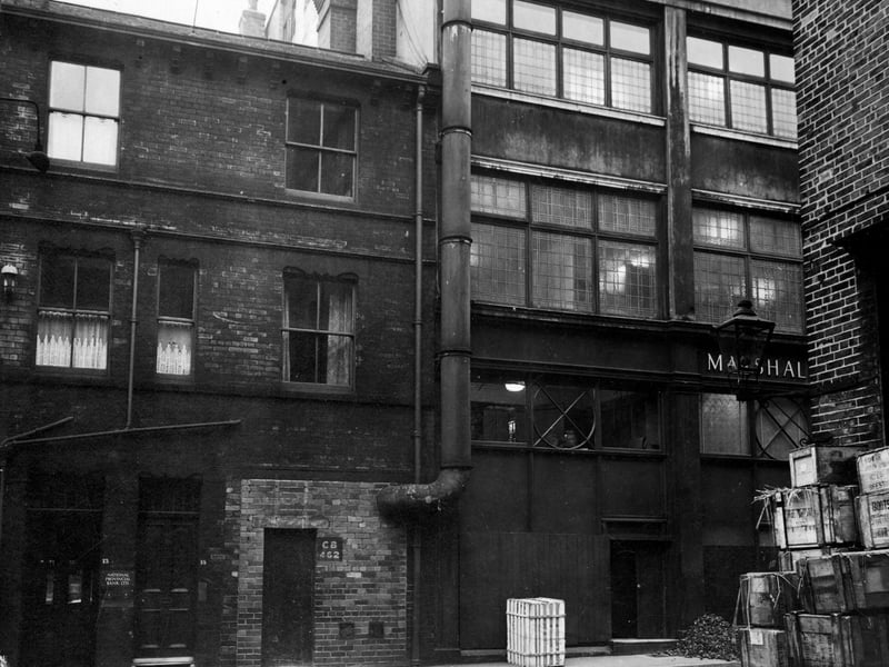  Looking west at Lower Basinghall Street, showing number 13, National Provincial Bank Ltd, and number 15, which has a tall metal pipe protruding from it. Next door are the premises of Marshall & Snelgrove, drapers (on the corner with Bond Street). Pictured in December 1946.
