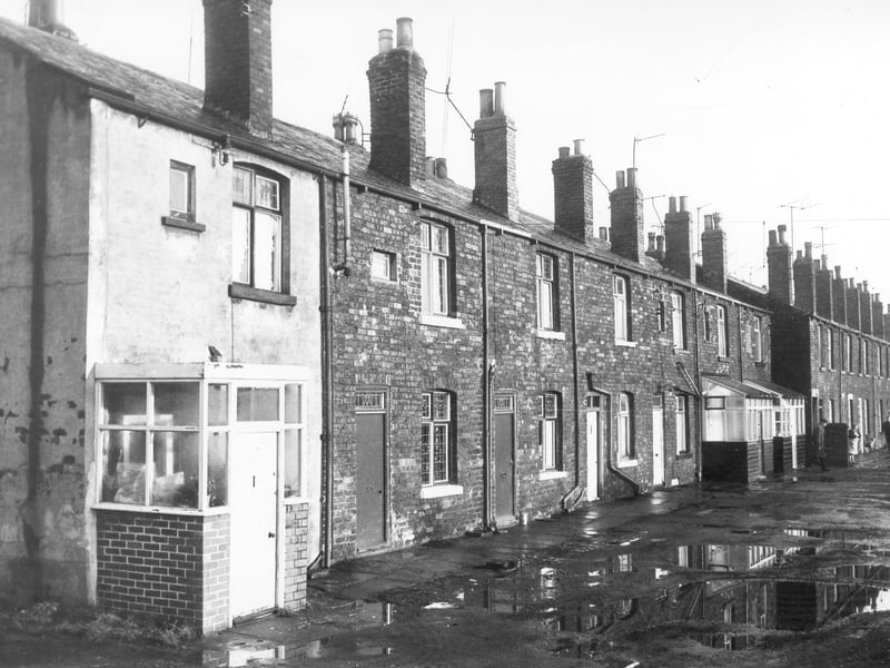 Looking along properties on Ashfield in January 1972. Numbers run to the right in ascending order from number 1 on the left. Numbers 1 to 7 were through properties also opening onto Whitehall Road. The rest of the houses were back-to-back.