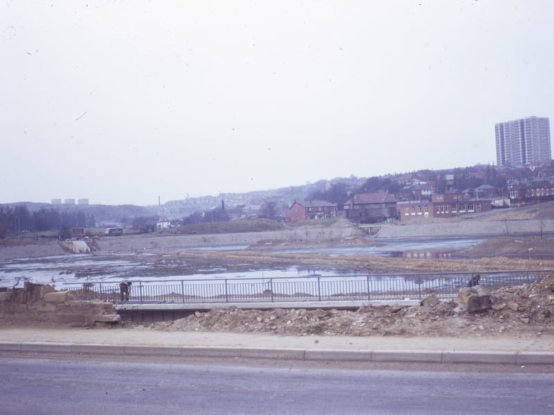 Looking from Tong Road onto a site being developed into a reservoir, bordered by Ring Road, Farnley on the left, Butt Lane at the far end, and Pudsey Road on the right. Pictured in March 1973.