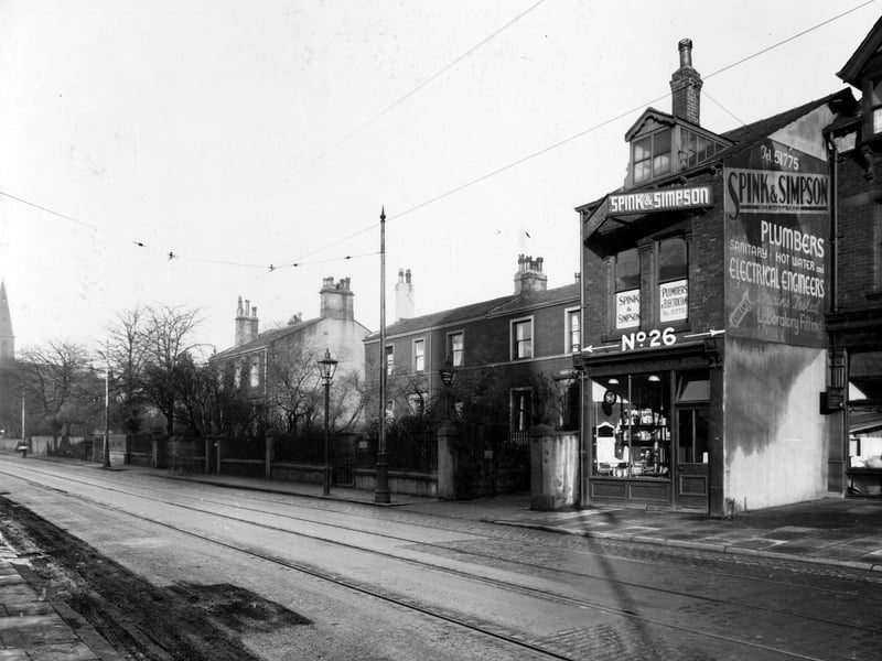 Headingley Lane in November 1937. The premises of Spink and Simpson plumbers and electricians are at number 30 (number 26 on photo is not property number). To left number 32, residence and office of Joseph Leonard Iredale surgeon. Number 34 William Cuthbert Morton, surgeon.