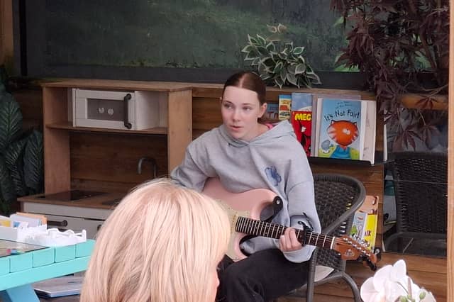 Singer Emily O'Sullivan performing at the event