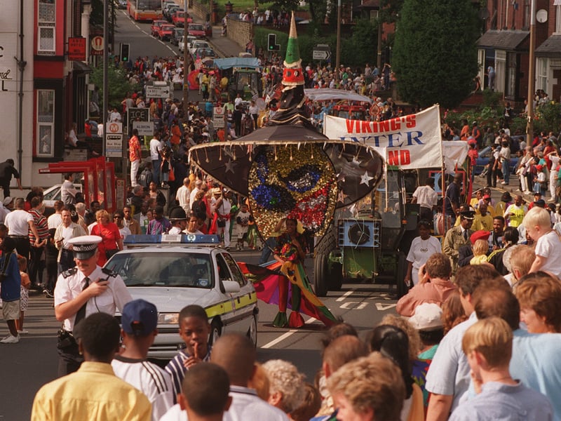 The carnival parade makes it's way down Harehills Lane.